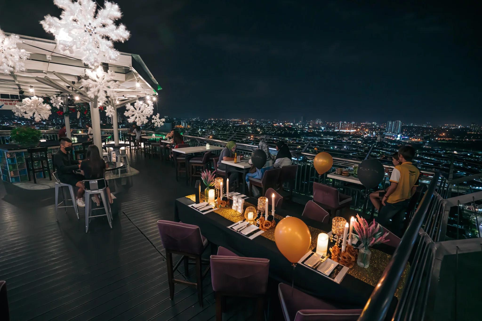A rooftop at the hotel at night