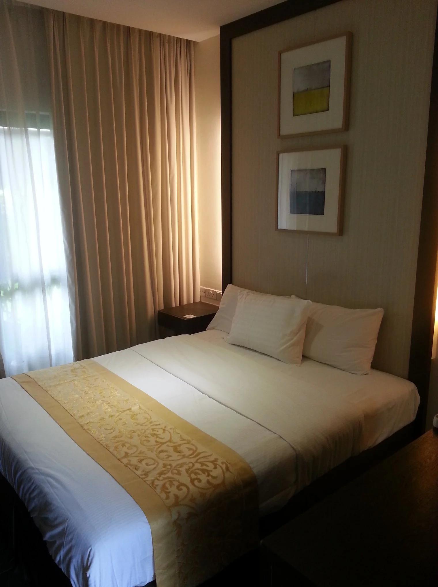 King-sized bed in Gallop Kranji Farm Resort bedroom